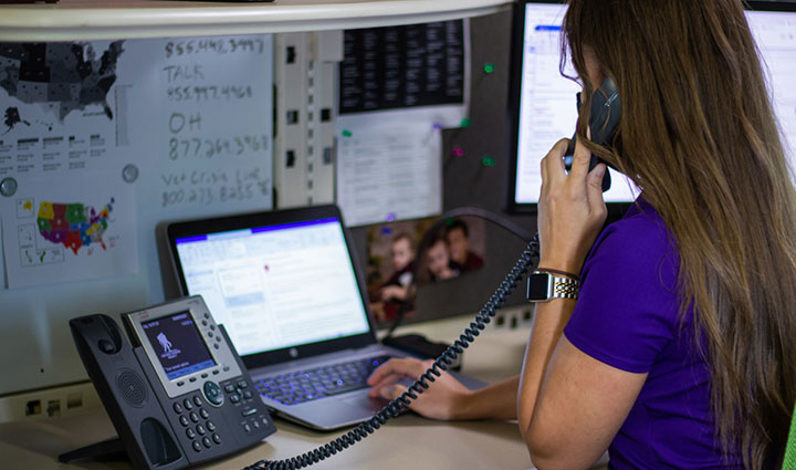 WWP Resource Center teammate answering questions over the phone about WWP and its programs.
